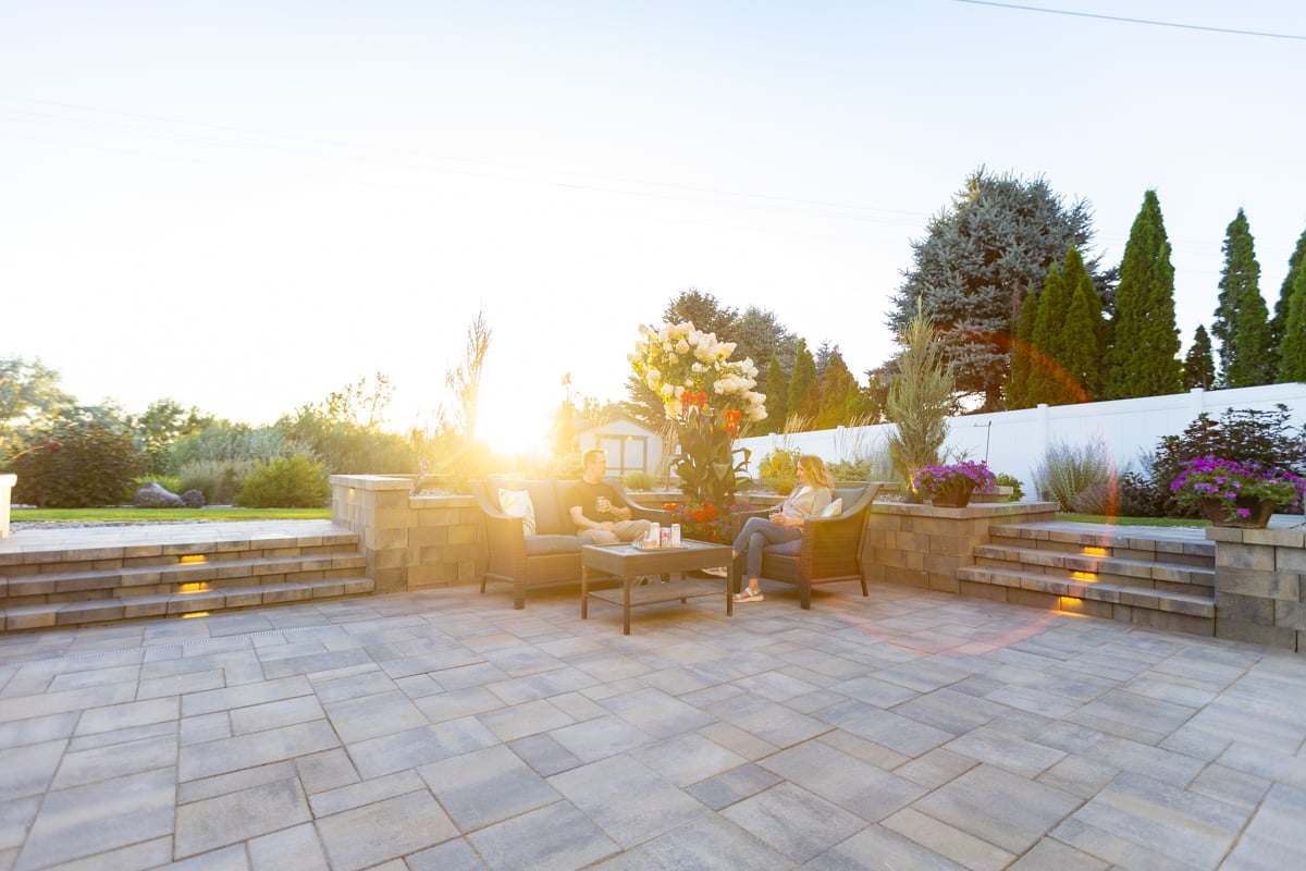 hardscape fire pit landscape lighting sitting wall paver patio furniture stone stairs customers family 5