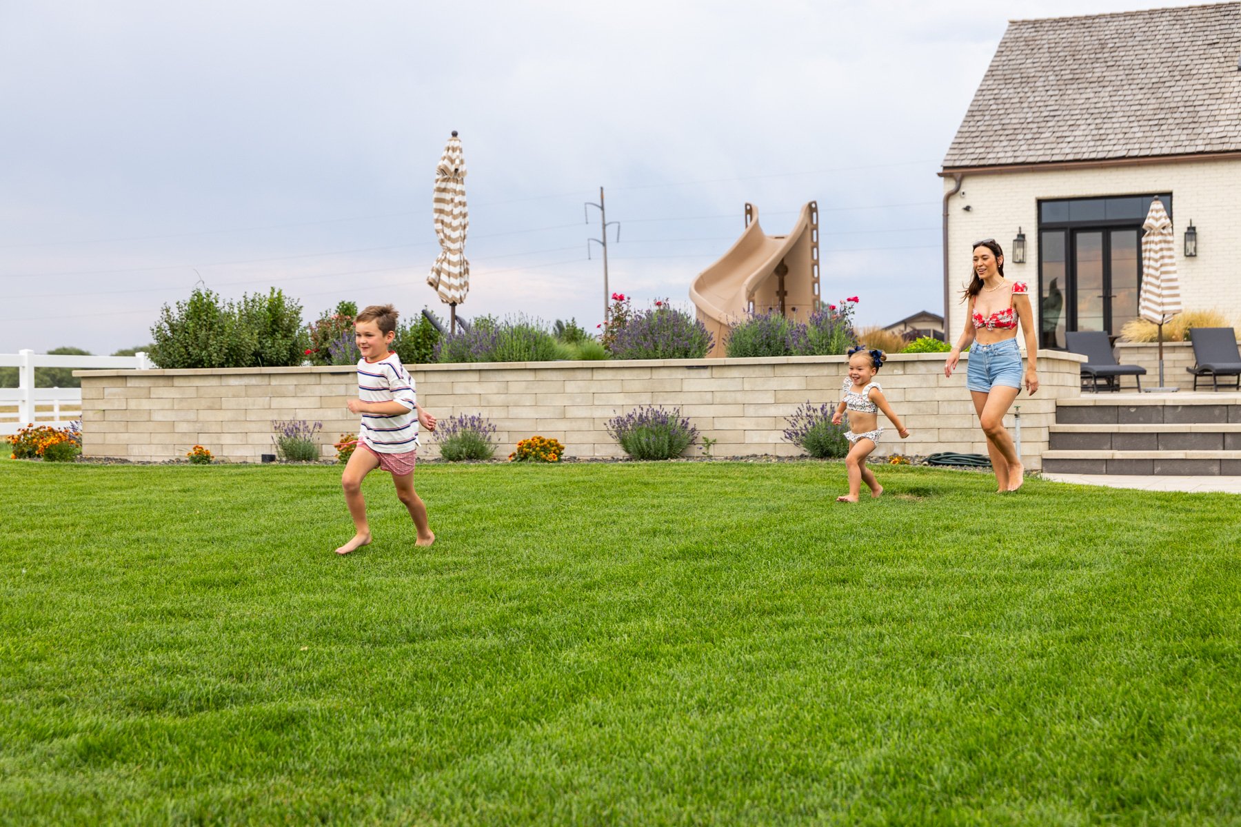 landscape maintenance customer children playing nice lawn wall patio