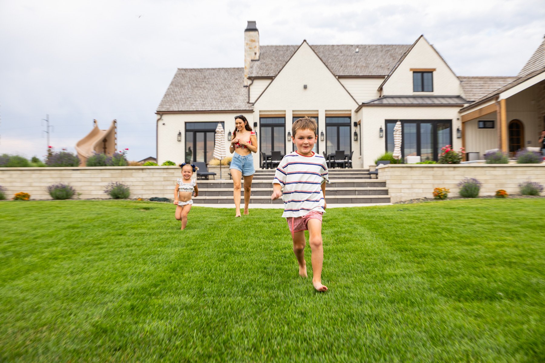 lawn care customer children playing in nice green lawn
