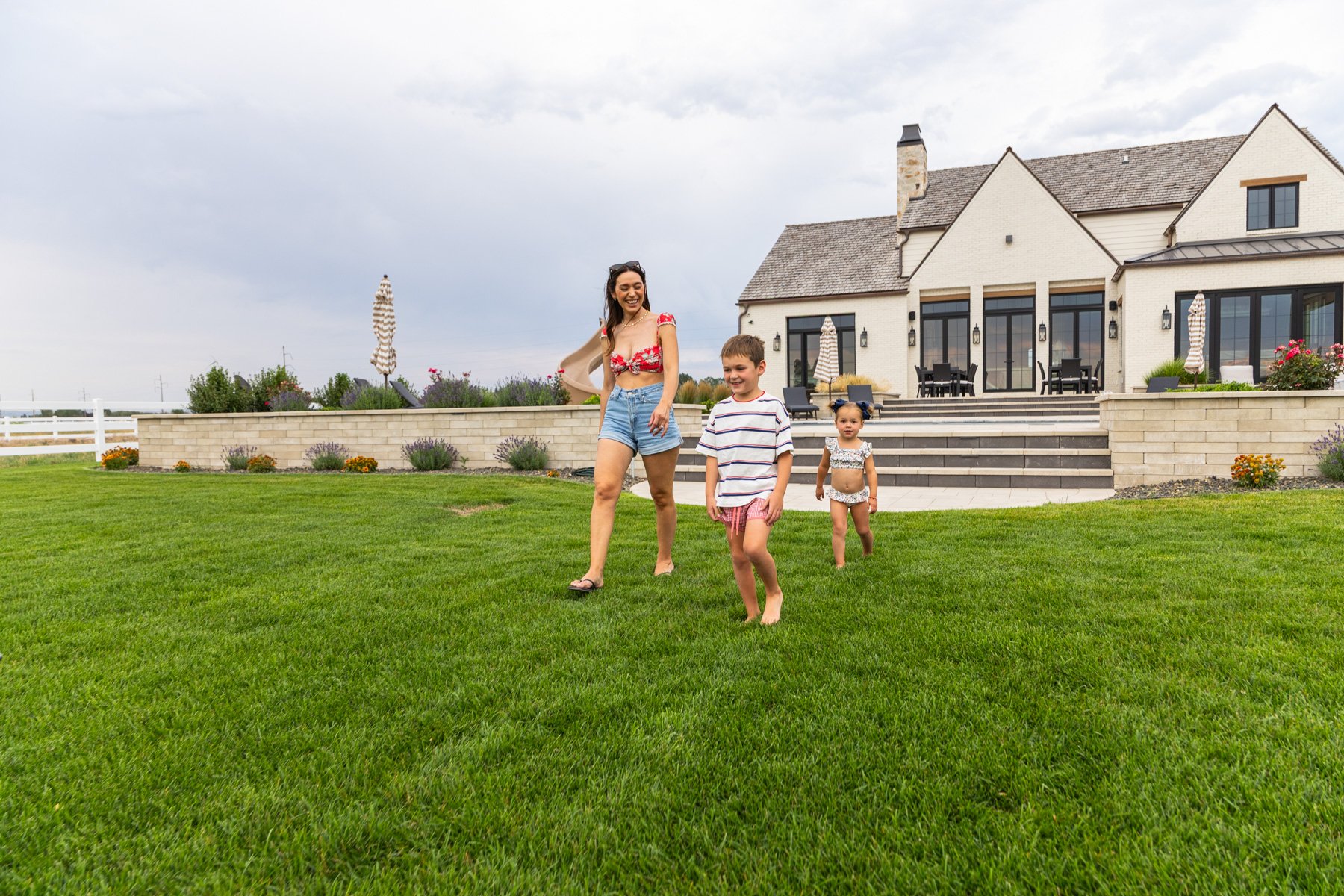 lawn care customer children playing in nice lawn