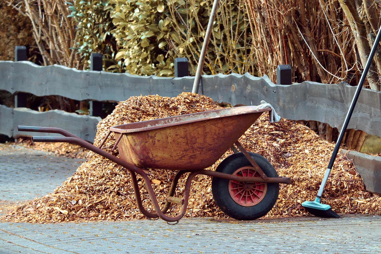 wheelbarrow and mulch pile