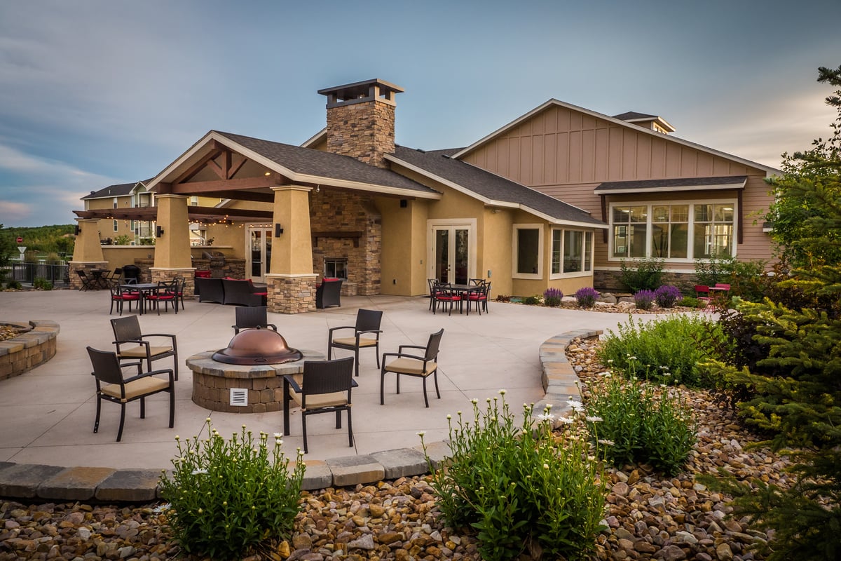 clubhouse at commercial property with flowers in landscape beds