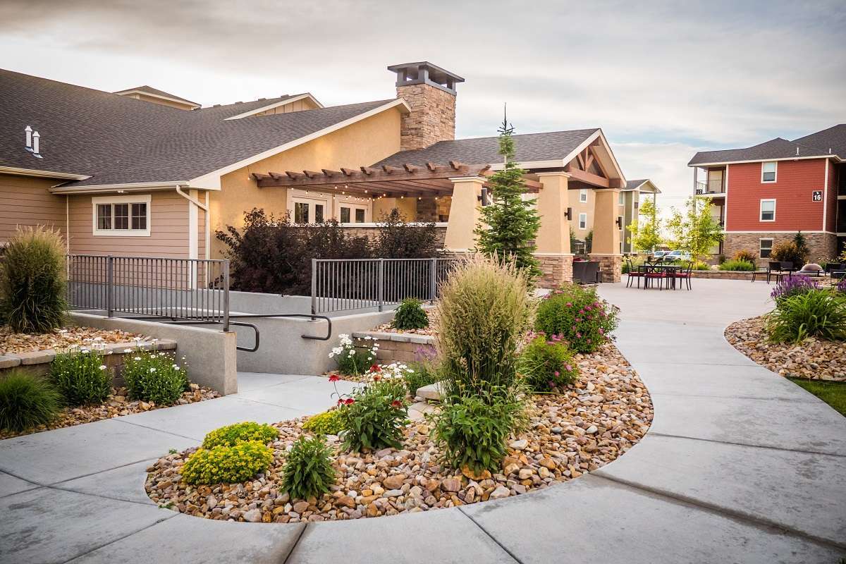 HOA landscape beds with river rock and perennials