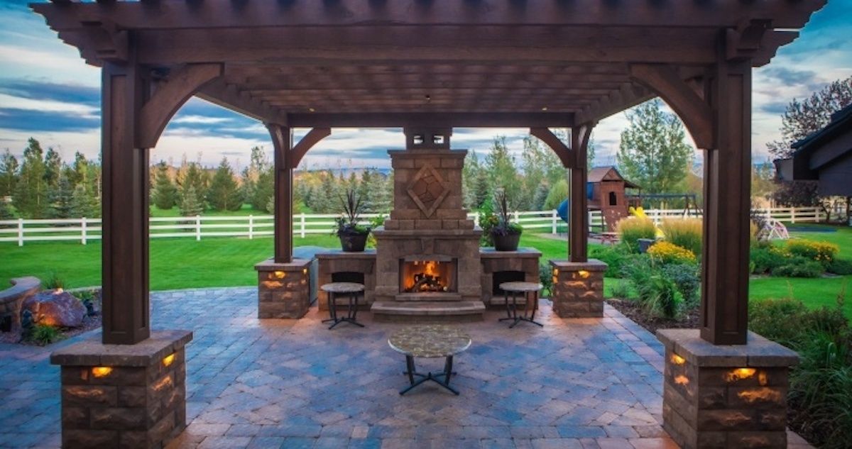 patio with outdoor fireplace and pergola