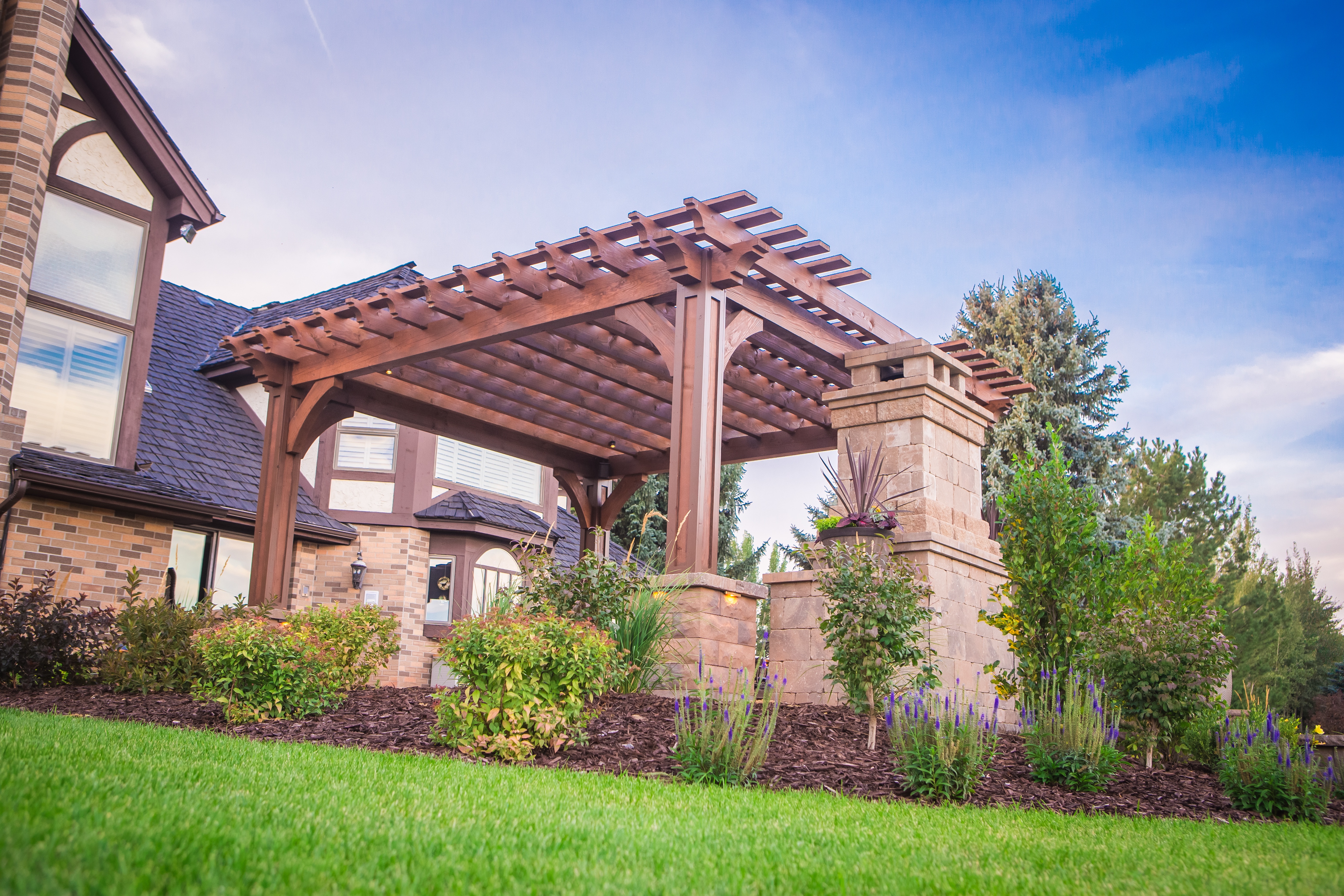 pergola with plantings and fireplace