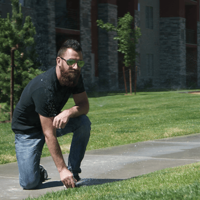 Chase Coates with lawn sprinkler