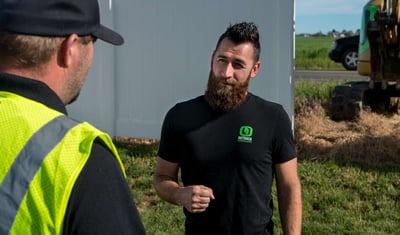 Chase Coates talking to Outback Landscape employee