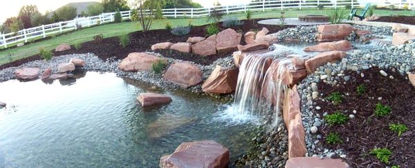 waterfall and pond water features in outdoor living space