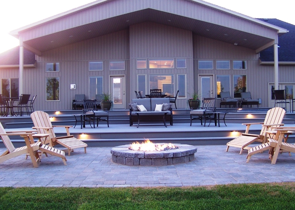 Fire pit on large patio in backyard