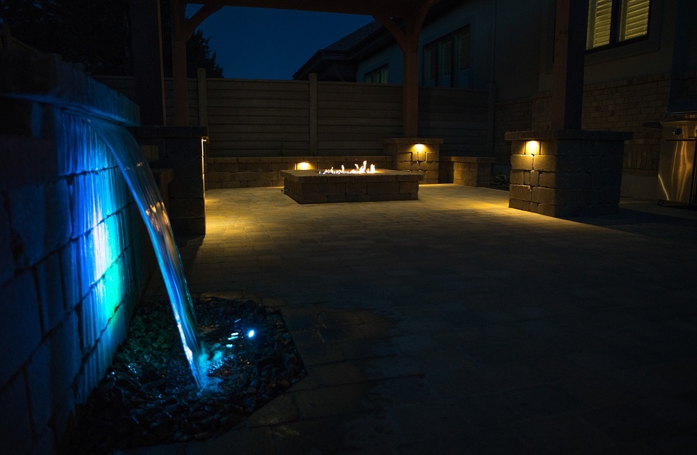 patio lighting with fire pit and waterfall