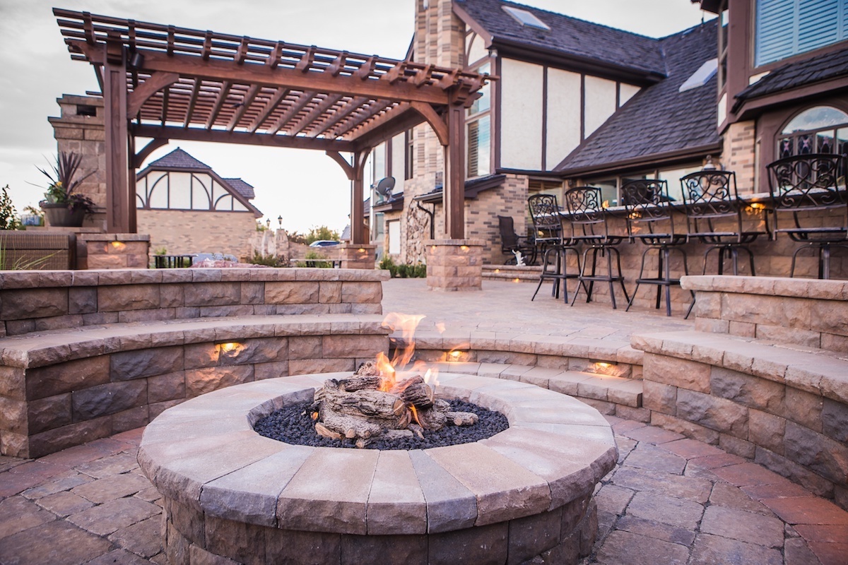 fire pit on patio with pergola