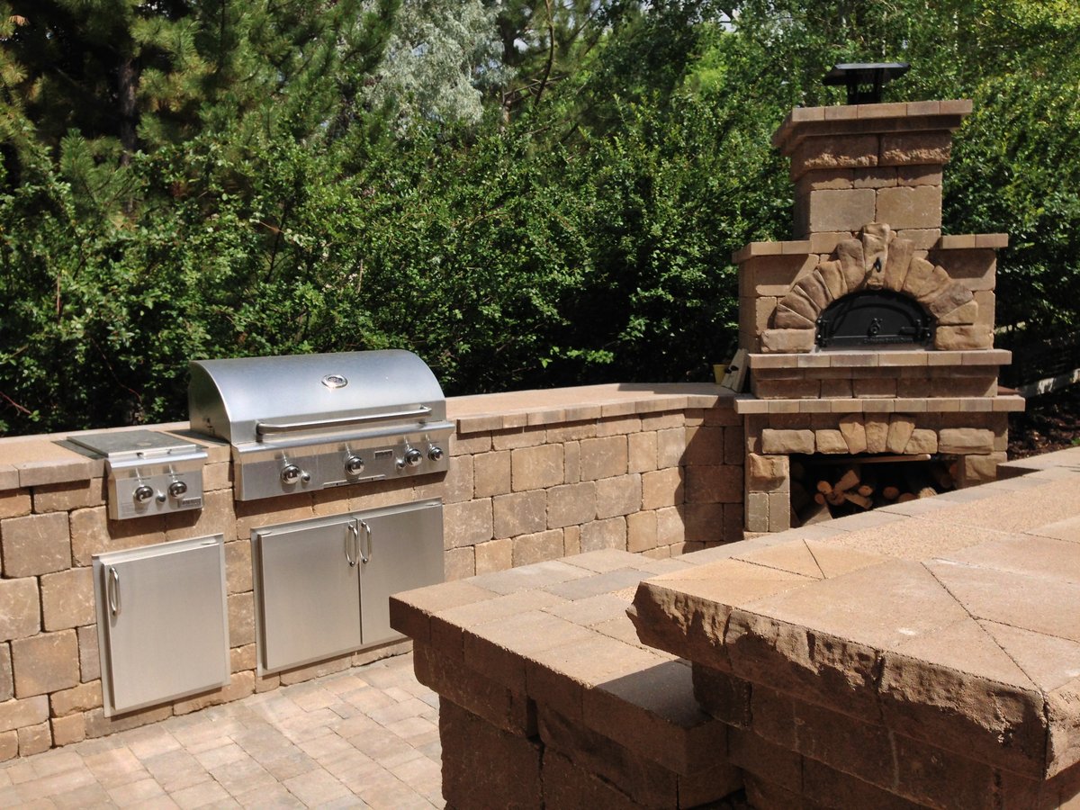 outdoor kitchen with wood pizza oven