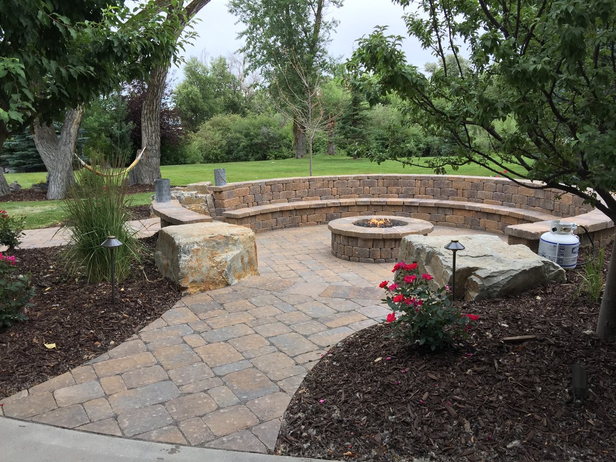 patio with firepit and seat wall