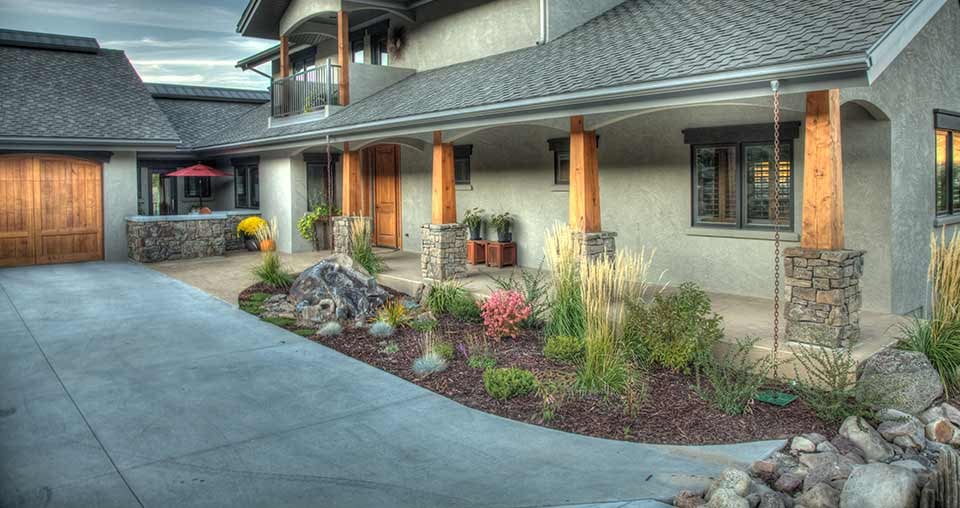 landscape bed with boulders and grasses