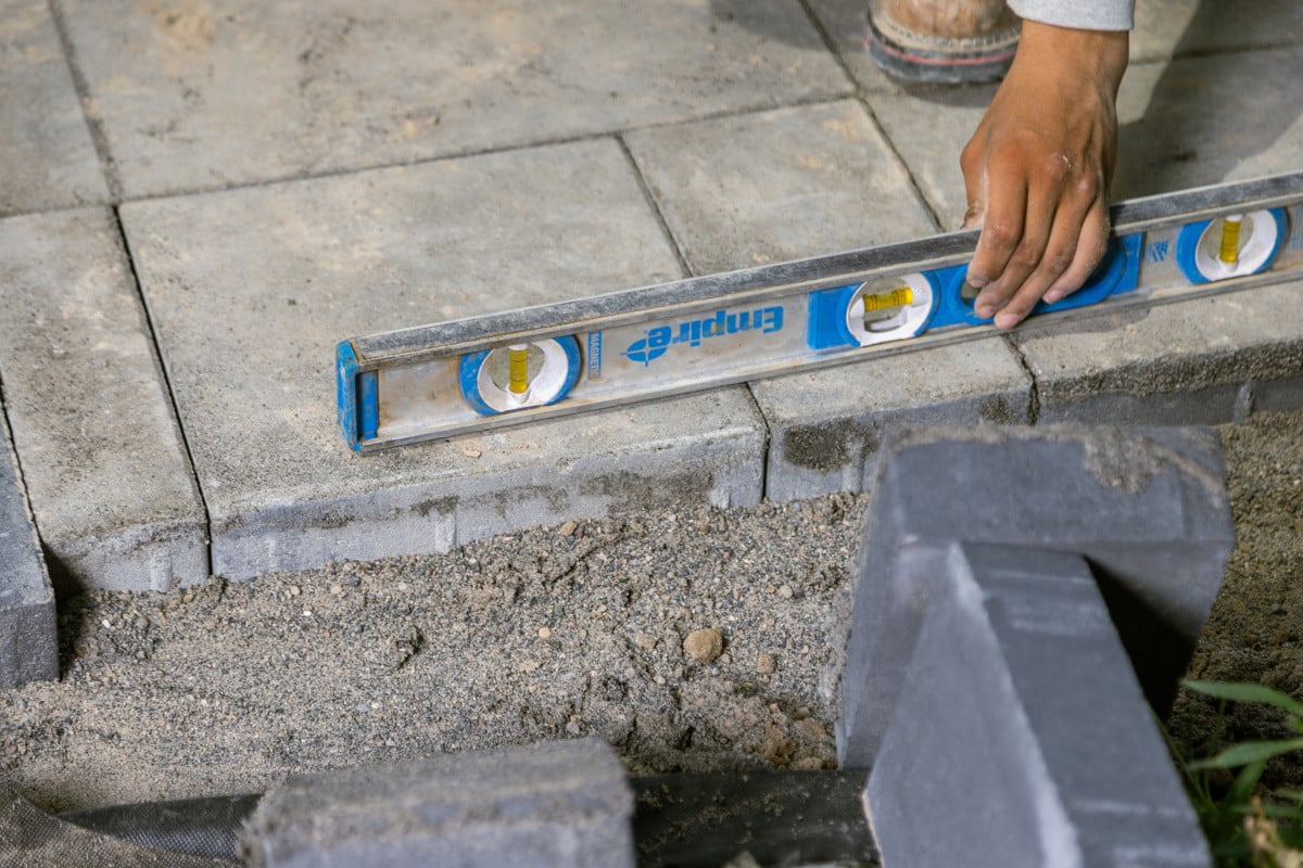 crew construction install paver action detail 5