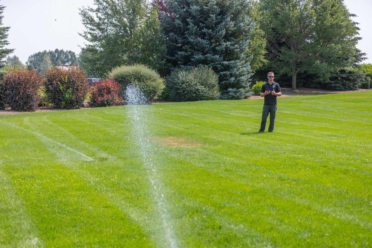crew technician irrigation lawn green grass turf service sprinkler water adjust 4