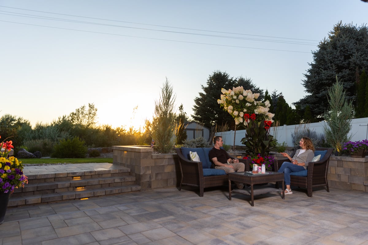 hardscape fire pit landscape lighting sitting wall paver patio furniture stone stairs customers family 7