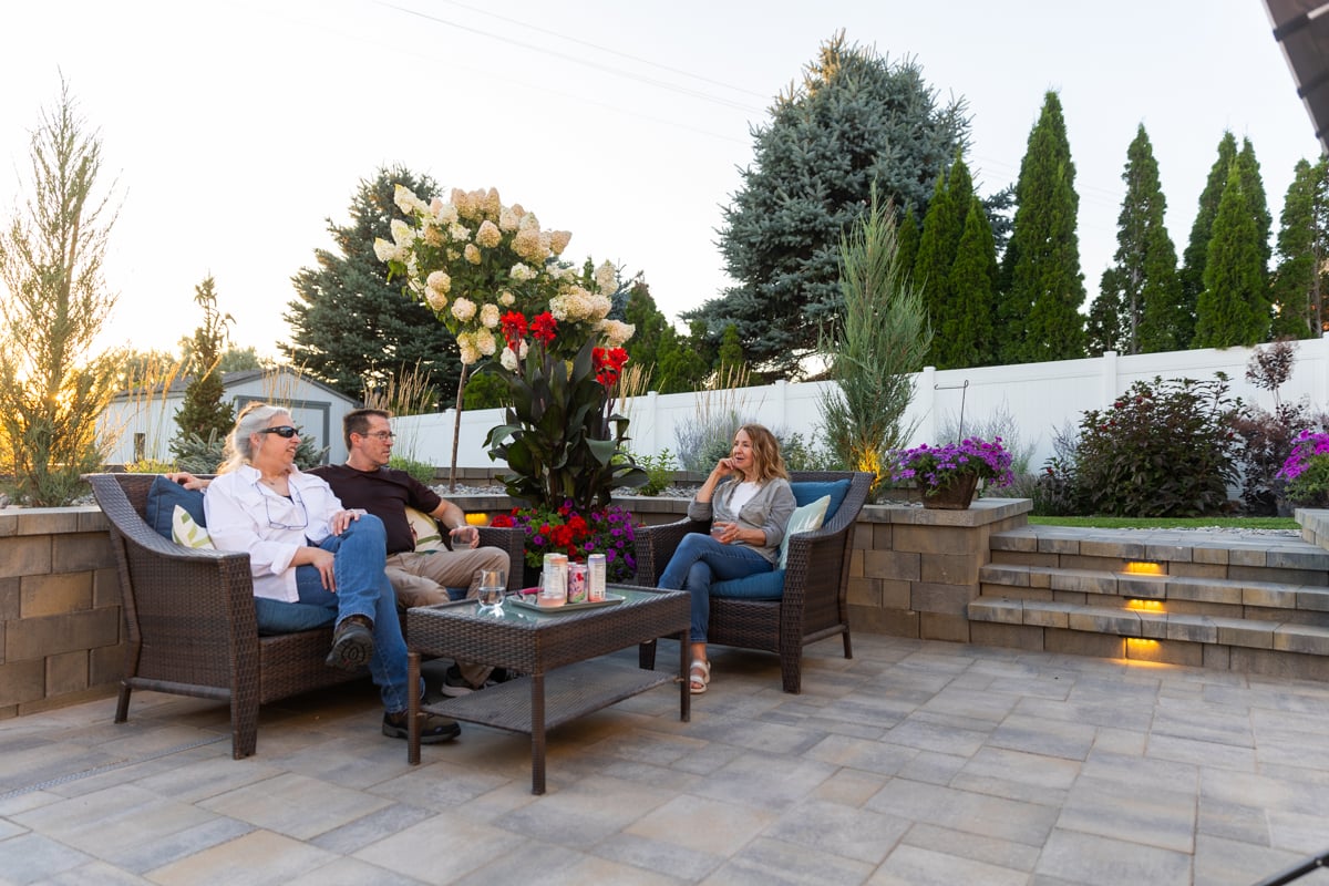 hardscape fire pit landscape lighting sitting wall paver patio furniture stone stairs sunset customers 4