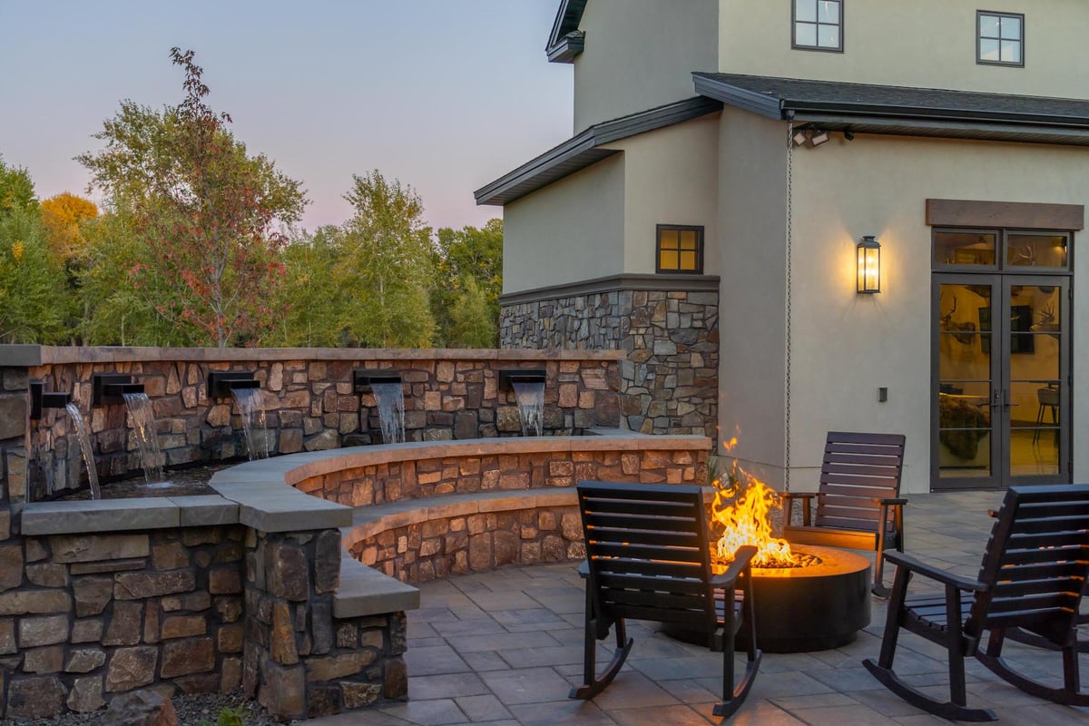 patio and fire pit with large water feature