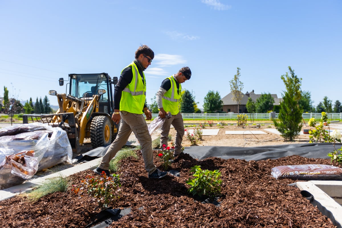 maintenance crew team mulch installation foundation planting beds 8