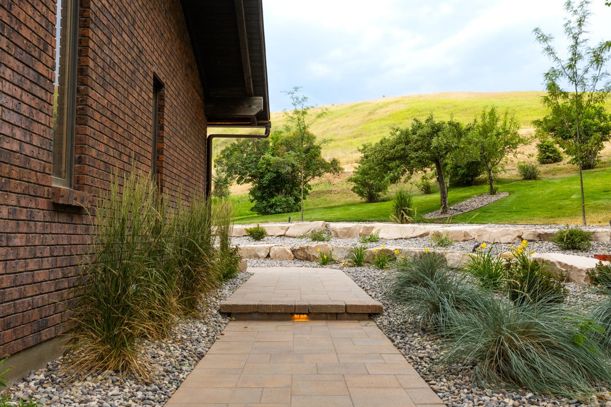 pathway home gravel plants grasses lighting 2