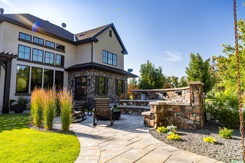 patio firepit chairs seating plants grass turf green lawn water feature waterfall home house gravel wall 3