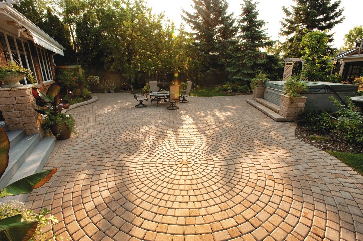 large paver patio with firebowl and hot tub