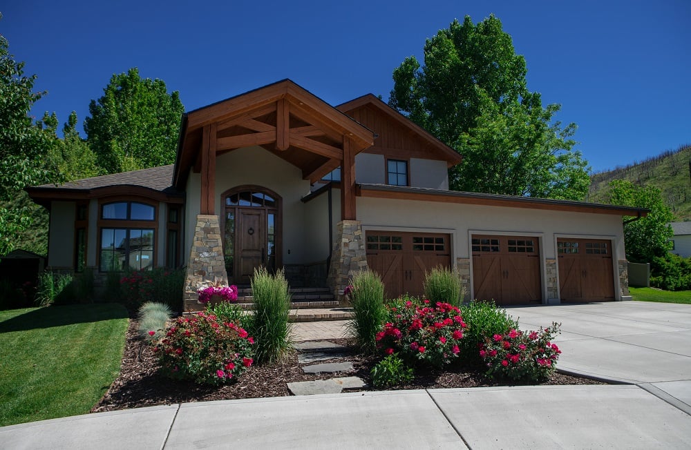 home entrance with roses ornamental grasses and mulch