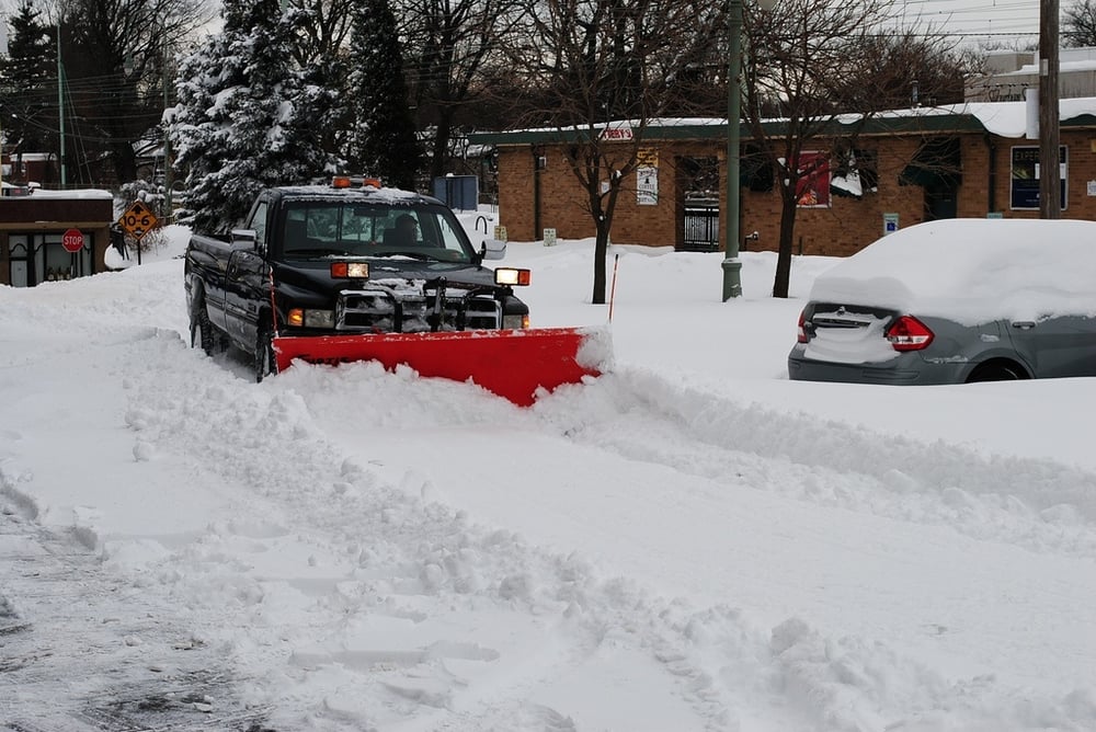 snow plow in parking lot