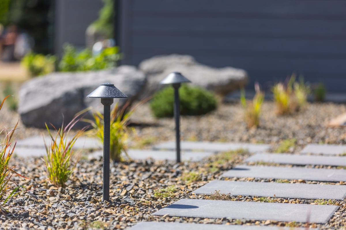 stepper walkway plantings gravel bed landscape lighting