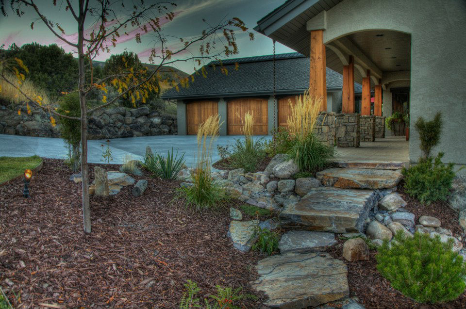 mulch planting bed with stepping stones and plants