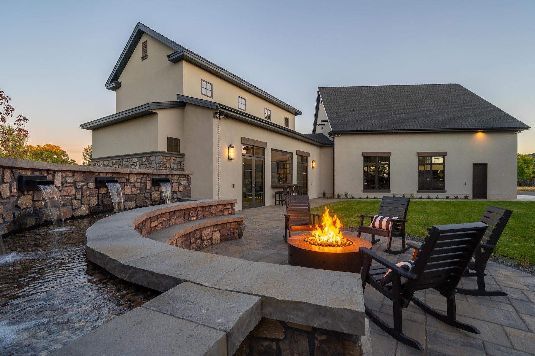 Fire pit in backyard with water fountain