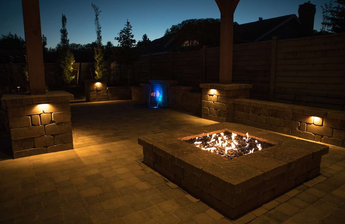 outdoor lighting with water feature and fire pit