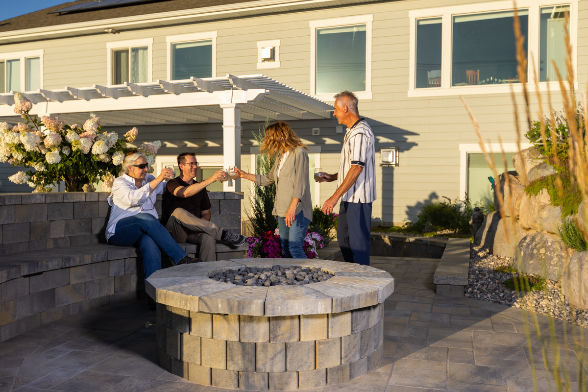 customers family patio planting grasses fire pit sitting wall hardscape pergola