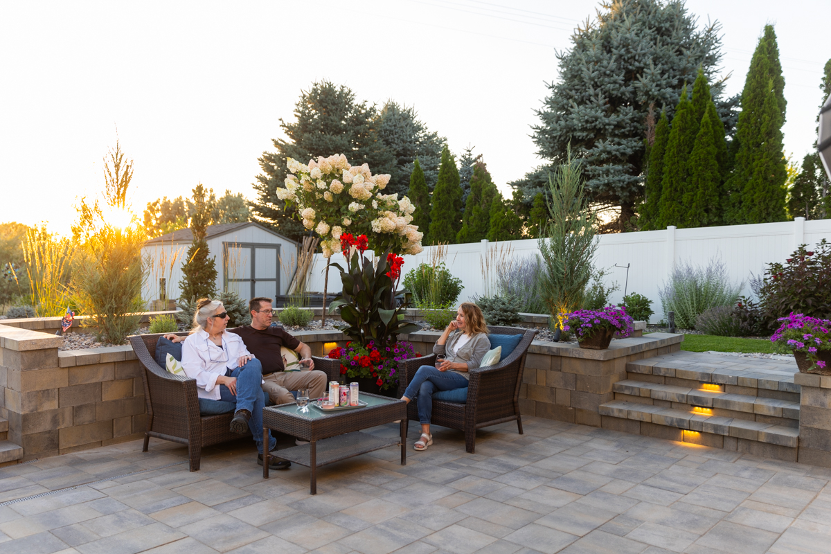 hardscape fire pit landscape lighting sitting wall paver patio furniture stone stairs sunset customers 17