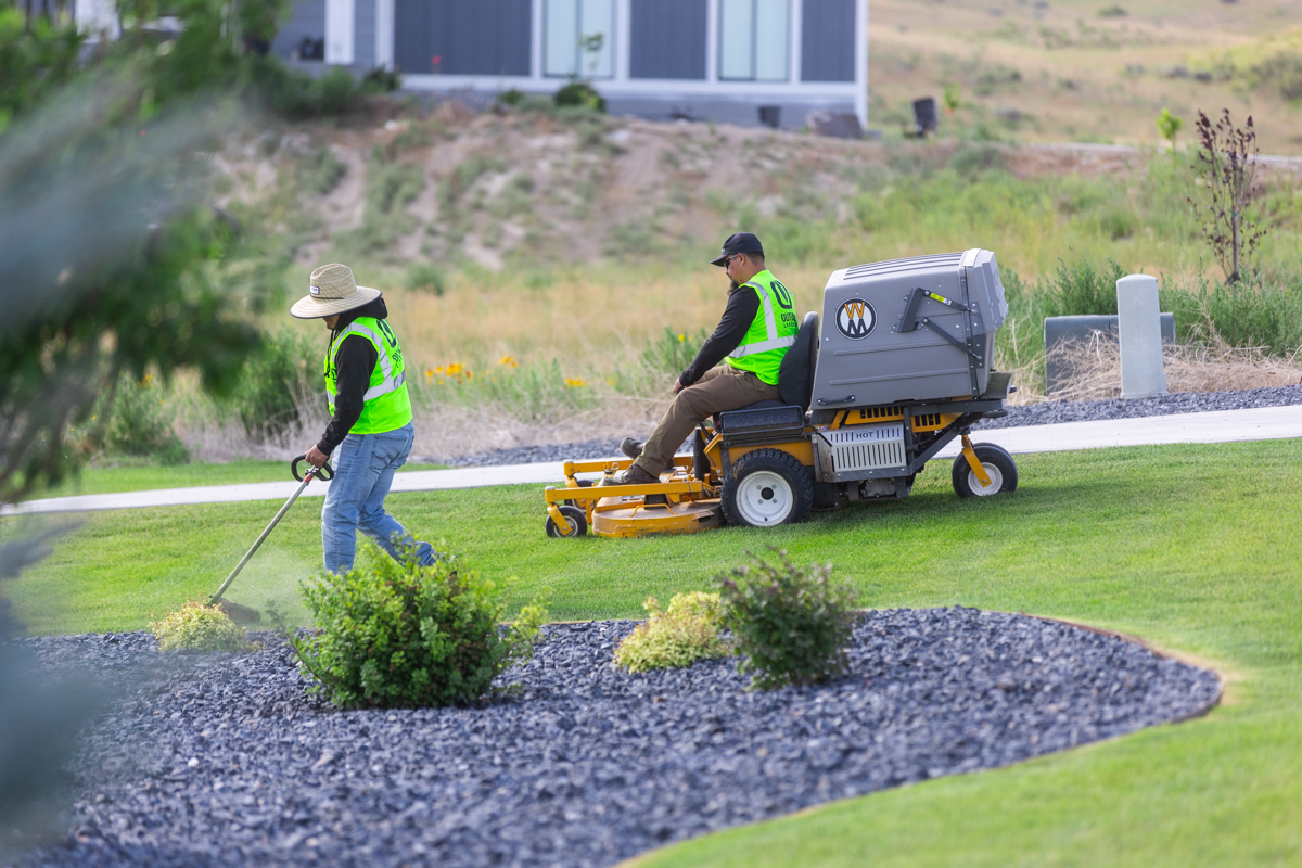 residential maintenance team crew bed edge gravel lawn mowing 2
